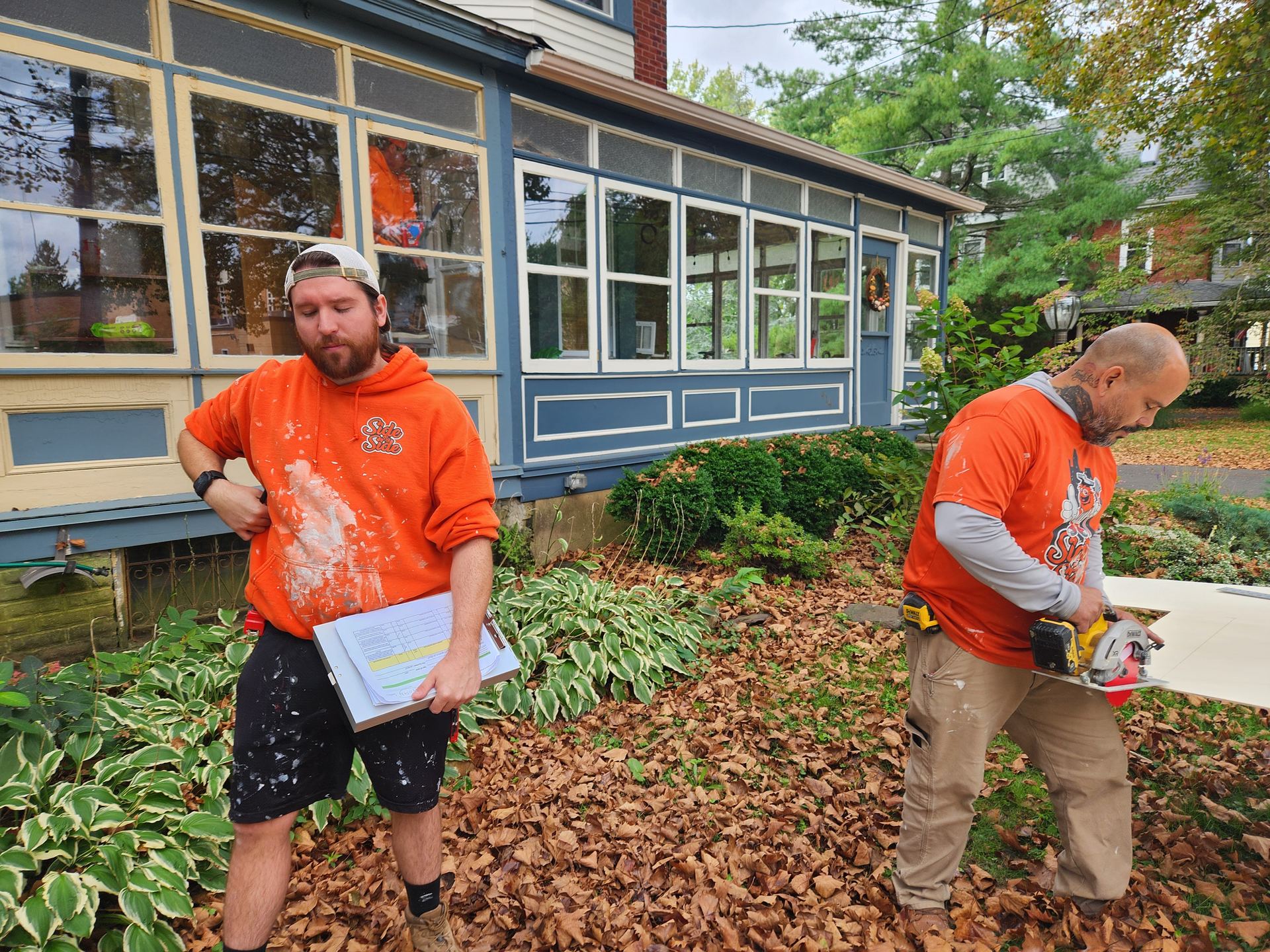 Side by Side crew in branded orange hoodies on a South Jersey job site