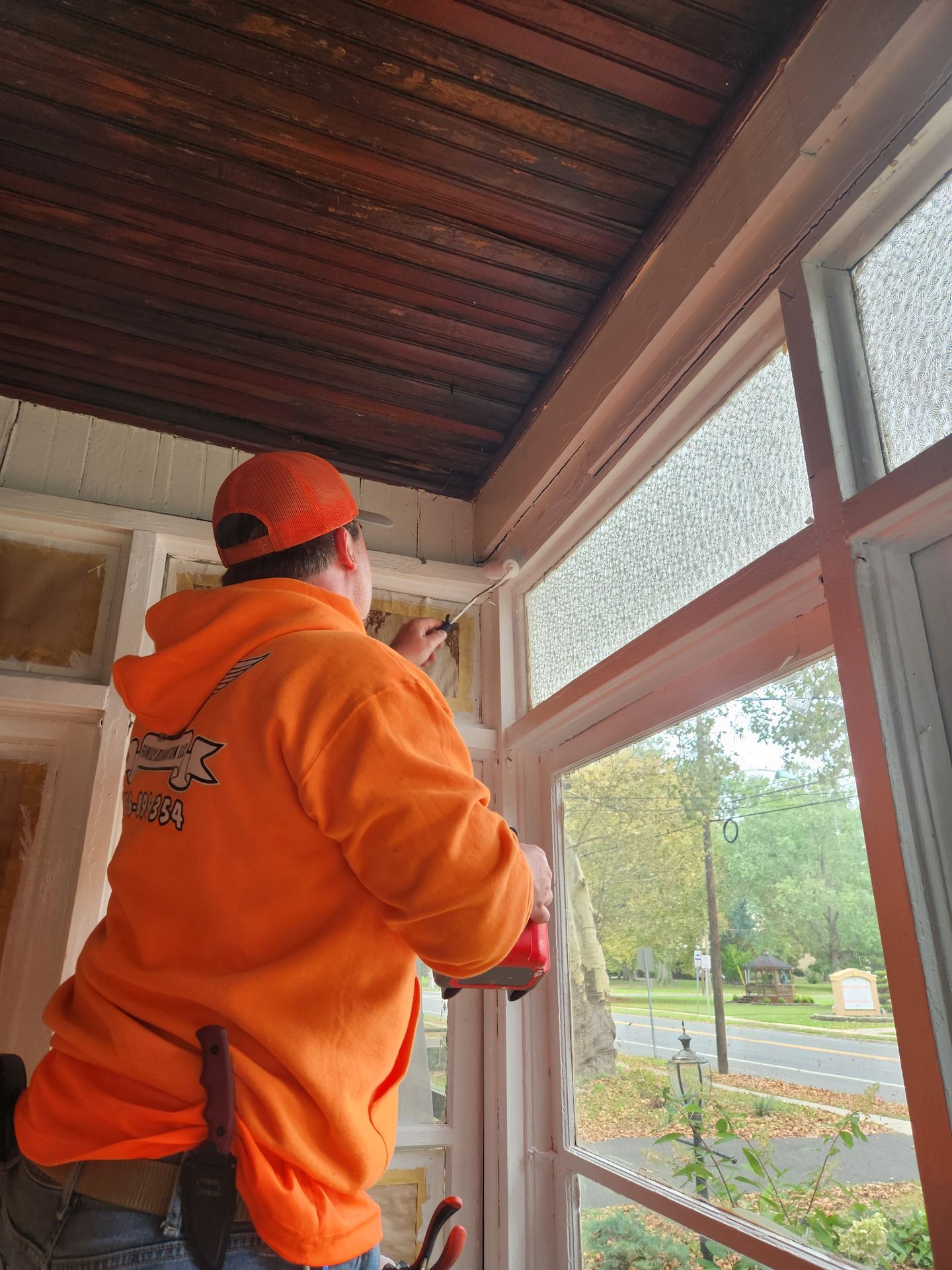 Side by Side maintenance technician installing a window in a South Jersey property