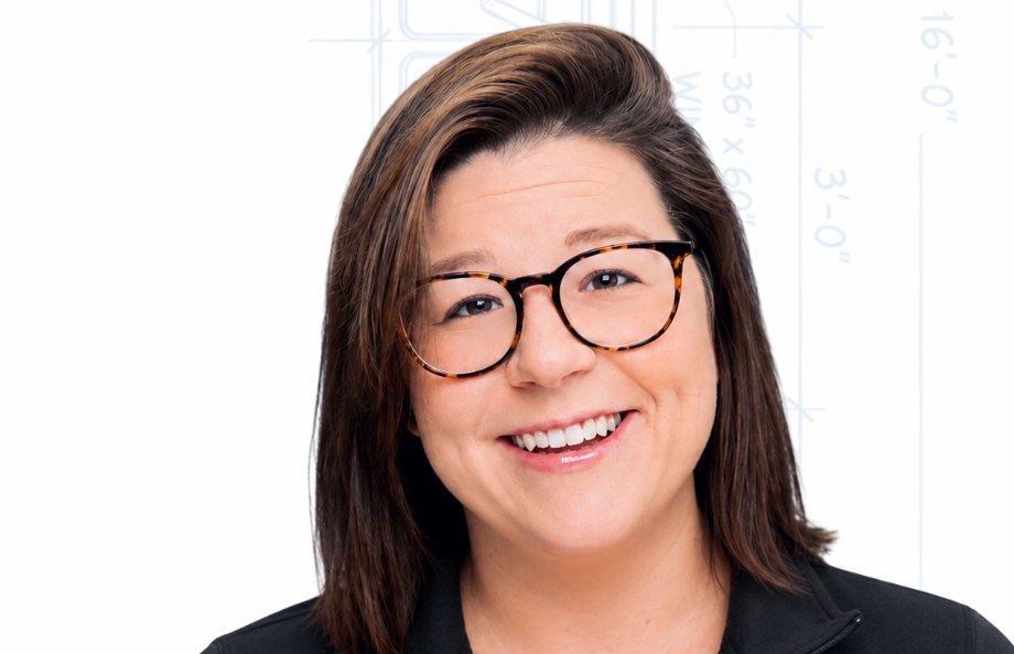 Madison Side, retail project manager at Side by Side, in a black Side by Side quarter-zip